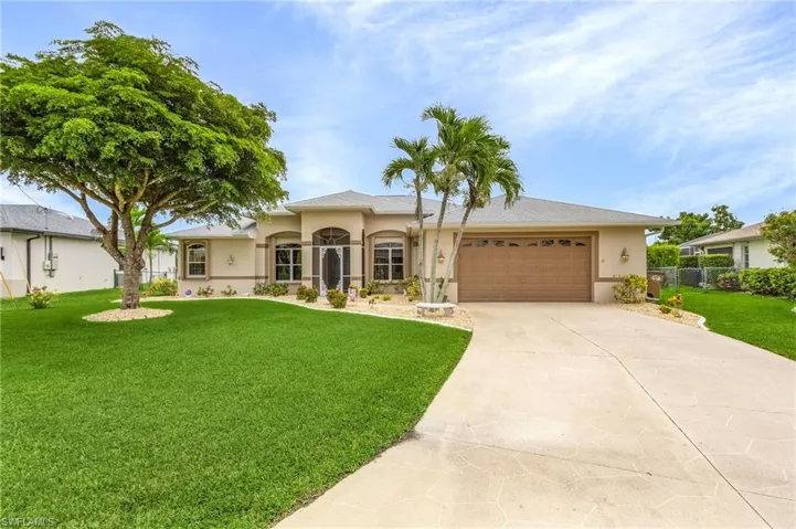 View of front of house sits on an oversized lot.