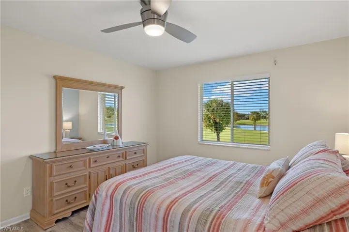 Bedroom featuring ceiling fan and light hardwood / wood-style floors