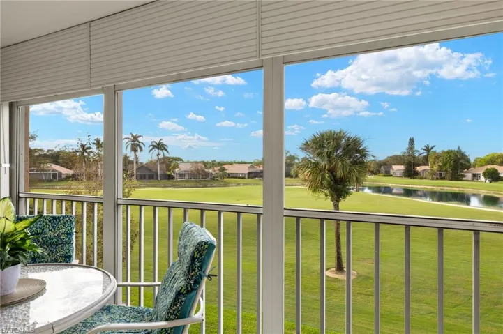 Sunroom with a water view