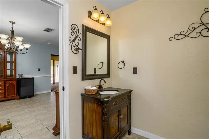 Bathroom with vanity, and tile patterned flooring