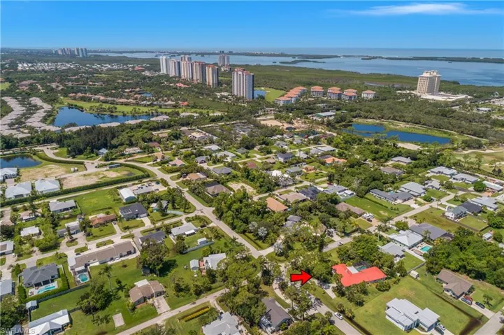Aerial overview of property's location with a nearby body of water