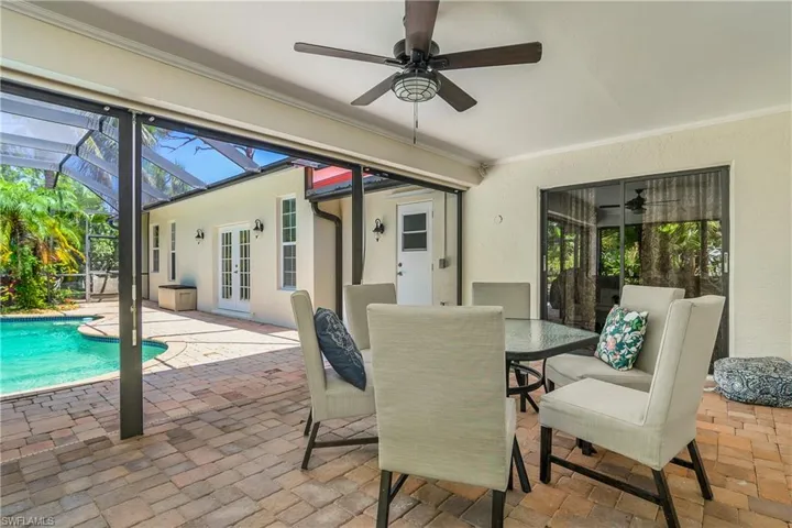 Dining space with a ceiling fan, crown molding, and plenty of natural light