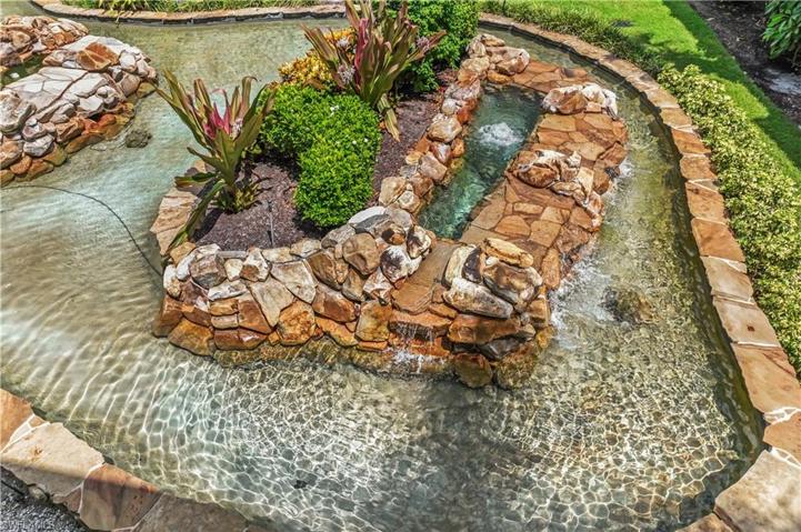 View of water feature from rear screened/glassed lanai