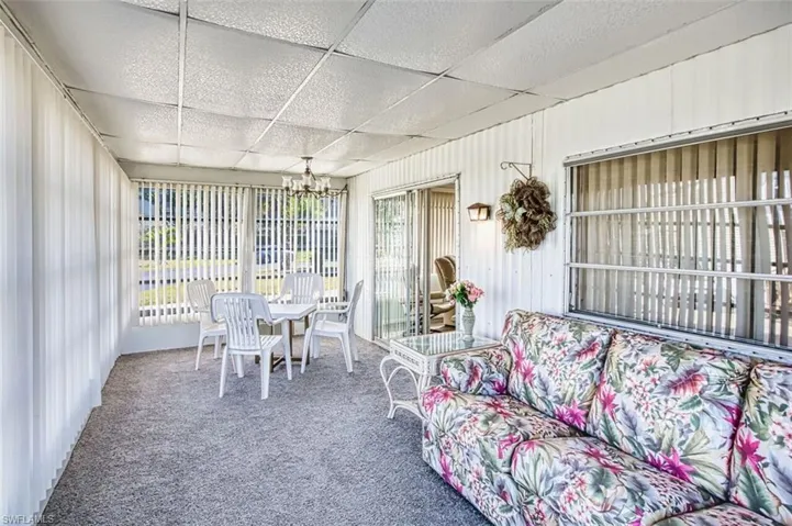 Sunroom with a chandelier and plenty of natural light