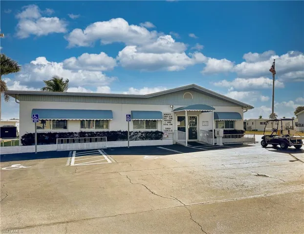 View of property with uncovered parking