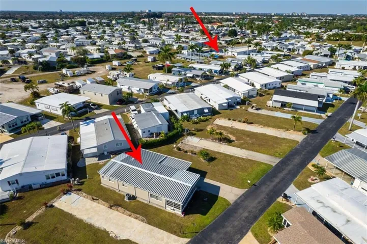 Aerial view of property's location with nearby suburban area