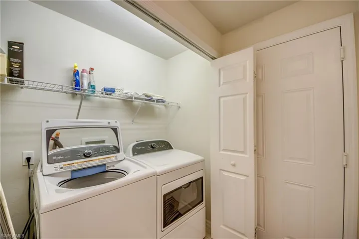 Laundry room featuring separate washer and dryer