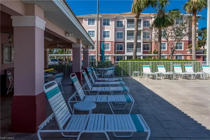 View of patio / terrace featuring a pool and ceiling fan
