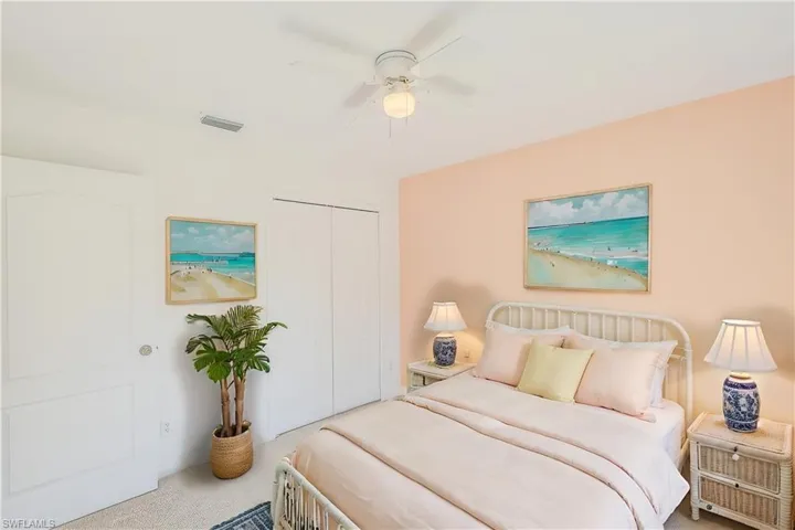 Bedroom featuring ceiling fan, a closet, and carpet flooring (This photo was virtually staged)