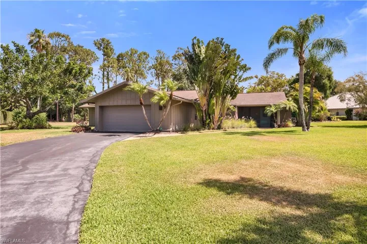 View of front of property featuring driveway and  attached garage
