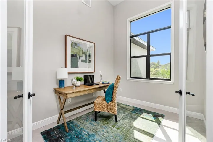 Office space with tile floors and french doors