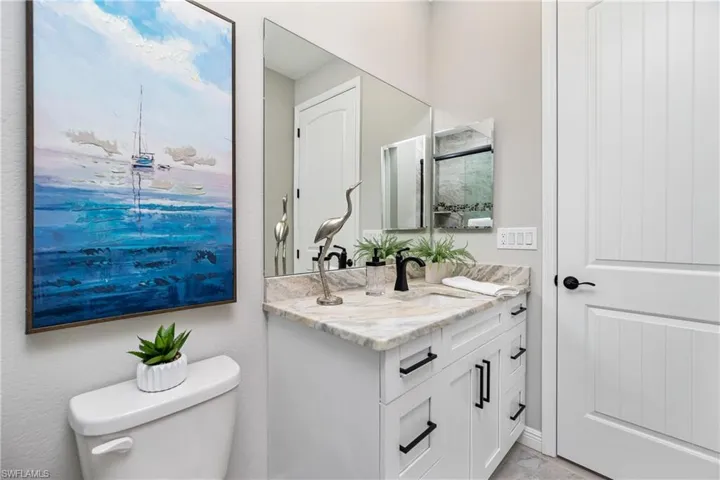 Bathroom with oversized vanity and toilet