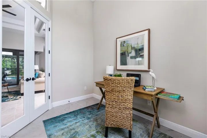 Tiled office space featuring french doors