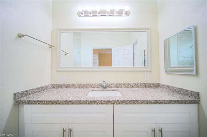 The Master Bathroom Has White Shaker Wood Cabinets, Granite, And A Tile Walk-In Shower!