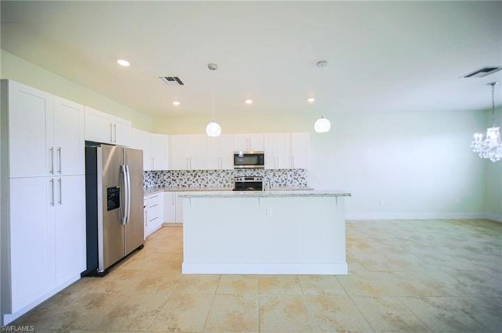 The Island Kitchen Comes With Granite Countertops, Tile Backsplash, Stainless Steel Appliances, And A Floor To Ceiling Pantry!
