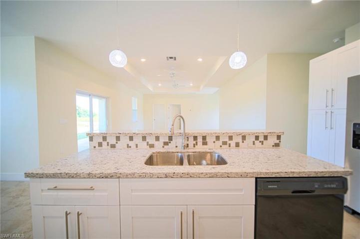 The Island Kitchen Comes With Granite Countertops, Tile Backsplash, Stainless Steel Appliances, And A Floor To Ceiling Pantry!