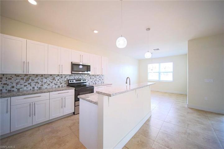 The Island Kitchen Comes With Granite Countertops, Tile Backsplash, Stainless Steel Appliances, And A Floor To Ceiling Pantry!