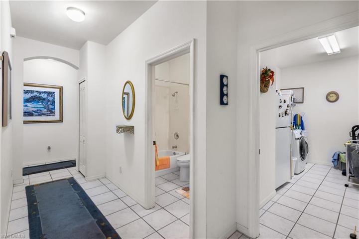 Hallway to guest bedroom, guest bathroom, laundry, garage