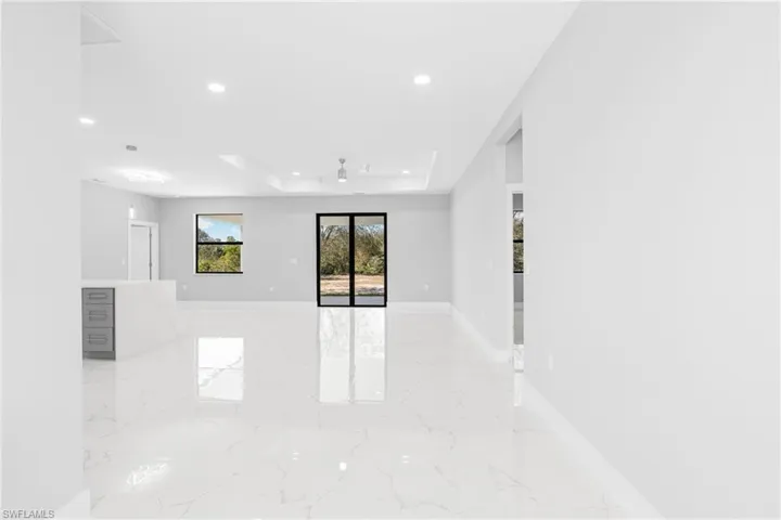 Spare room with a raised ceiling