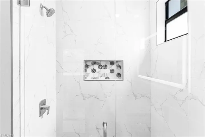Bathroom featuring a shower with shower door