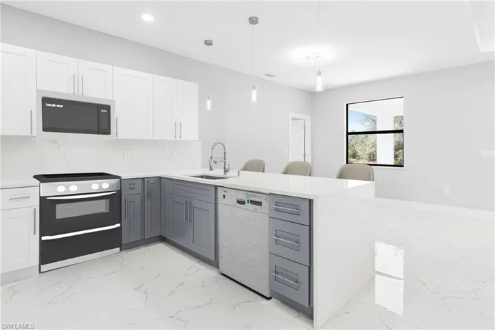 Kitchen featuring gray cabinets, white cabinetry, sink, and white dishwasher