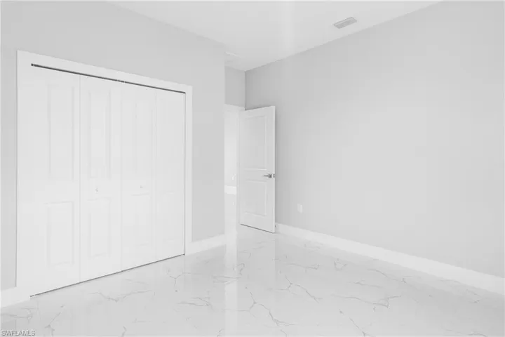 Unfurnished bedroom featuring a closet