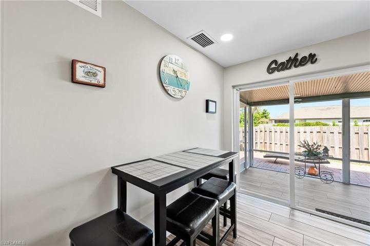 Dining area with sliders to lanai and patio