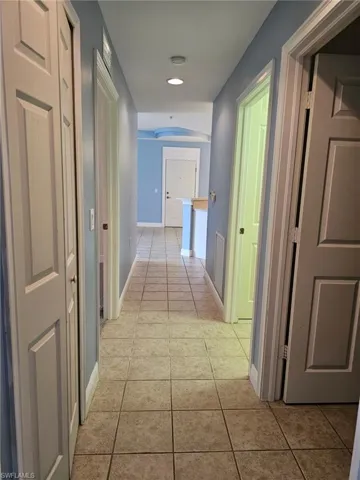 Corridor with light tile flooring