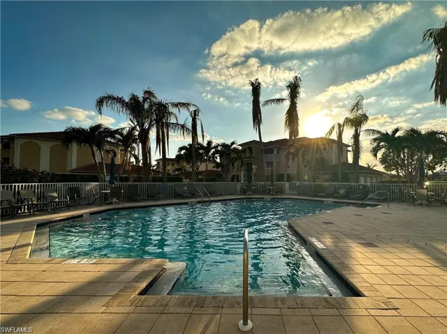 View of pool at dusk