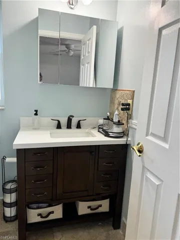 Bathroom featuring vanity and tile patterned flooring