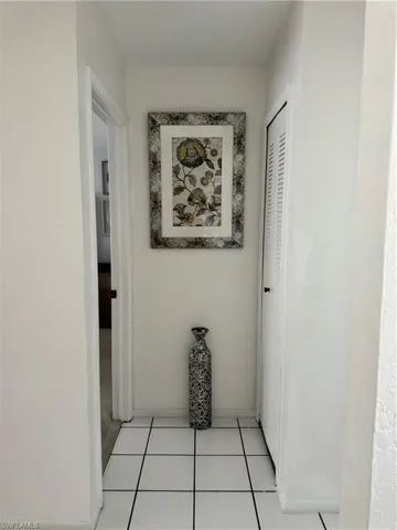 Hall with light tile patterned floors