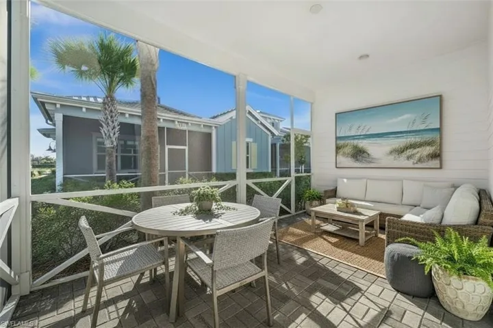 Sunroom / solarium with outdoor dining space
