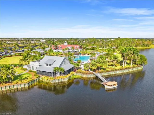 Bird's eye view of a nearby body of water and a tree filled landscape