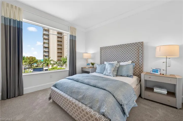 Bedroom 3 with light carpeting ,and large window for natural light