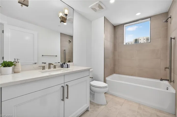 Bathroom 3 Full bathroom featuring shower / bath combo with shower curtain, vanity, and recessed lighting