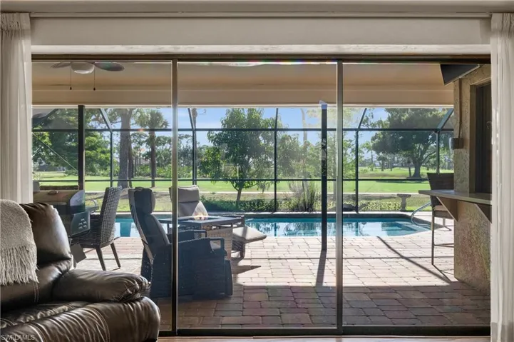 View of swimming pool featuring view of golf course