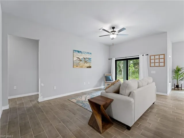Living room featuring ceiling fan