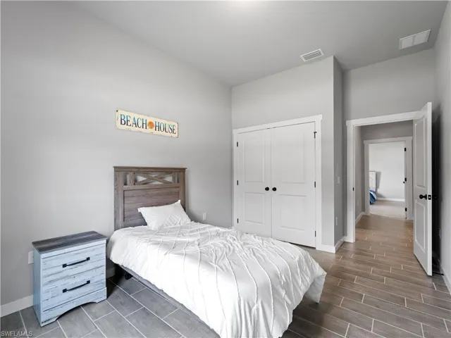 Bedroom featuring a closet and hardwood / wood-style flooring