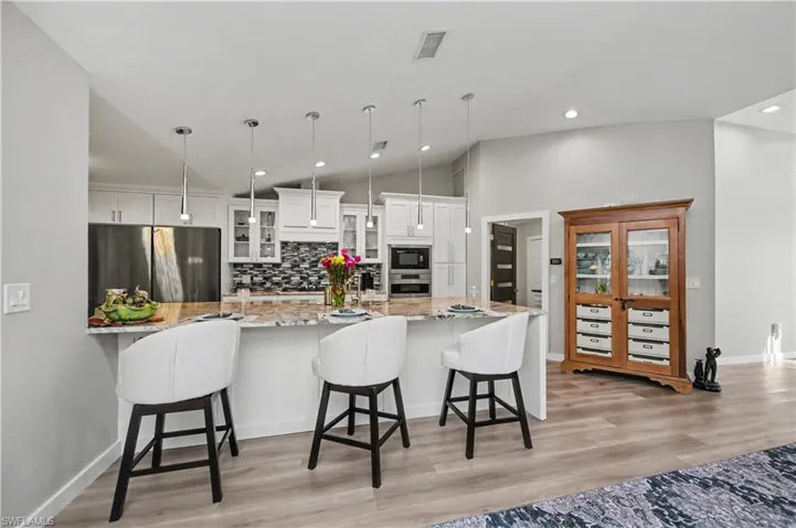 kitchen and entrance to laundry room and garage from great room