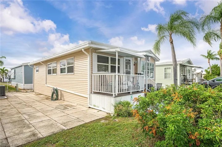 View of home's exterior featuring a patio and a central AC unit