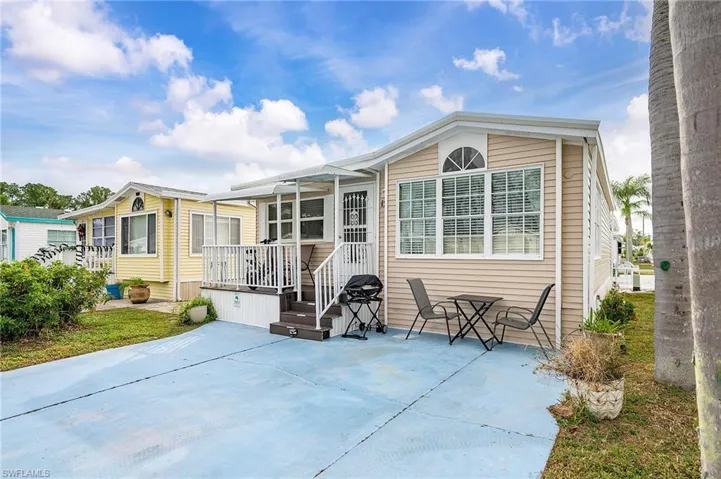 Back of house with a patio