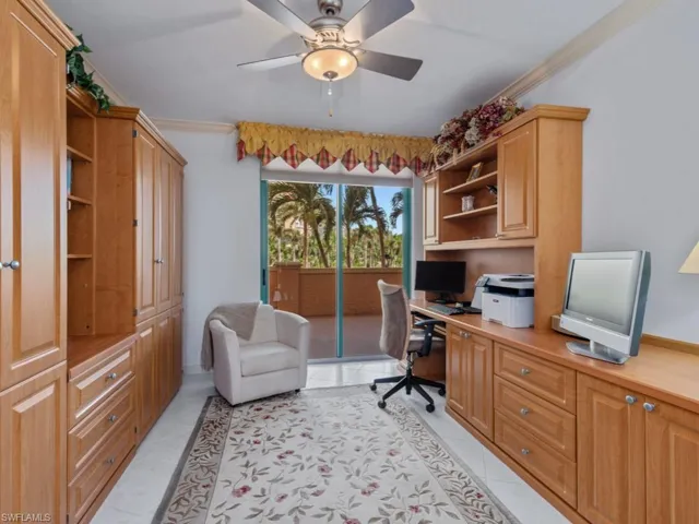 Office featuring built in study area, light tile patterned floors, a ceiling fan, and crown molding