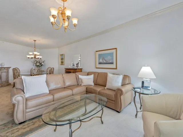 Living room with a chandelier and crown molding