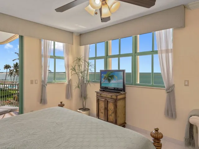 Bedroom featuring access to outside and ceiling fan