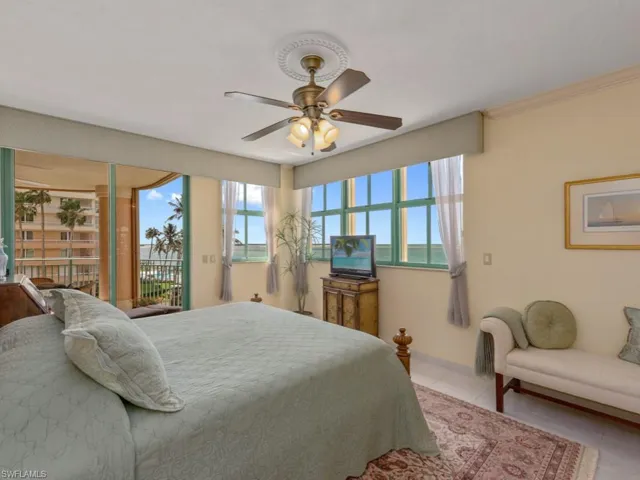 Bedroom featuring access to outside, tile patterned flooring, ceiling fan, and crown molding