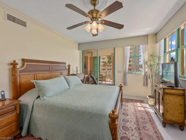 Bedroom featuring access to outside, a ceiling fan, and crown molding