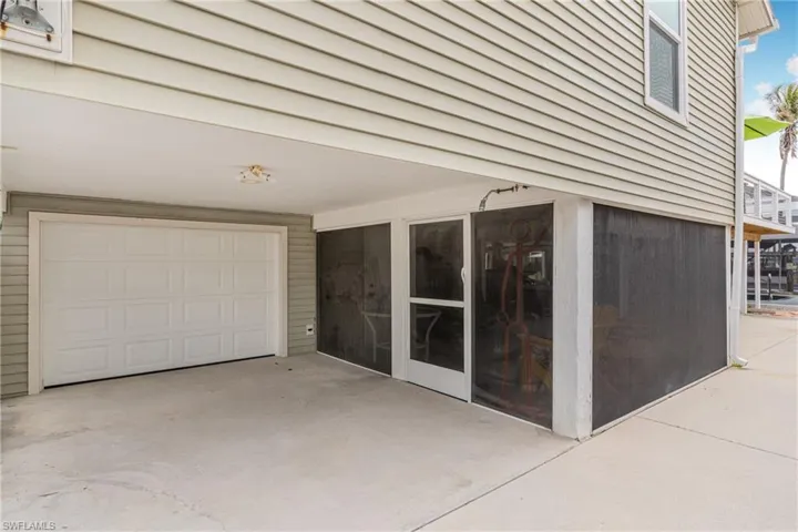 Property entrance with a garage