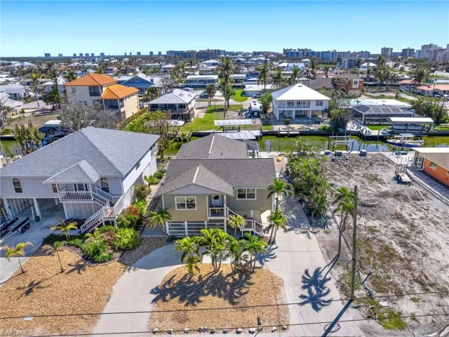 Aerial perspective of suburban area with a nearby body of water