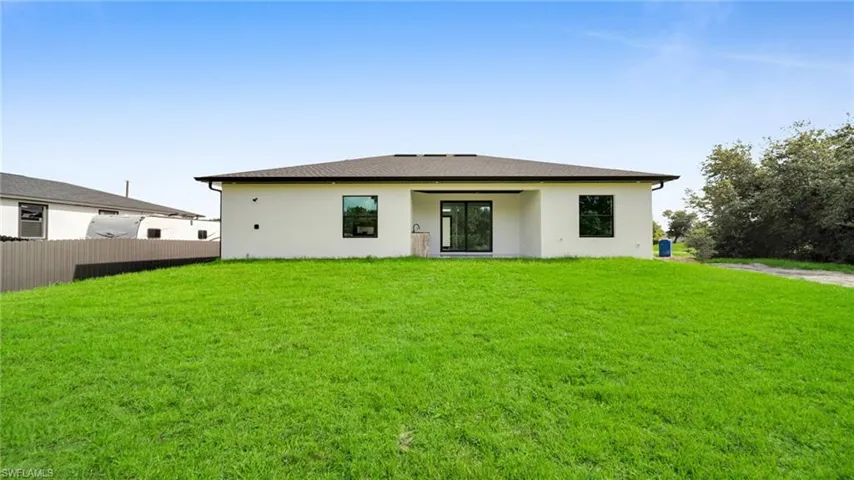 Back of house with stucco siding