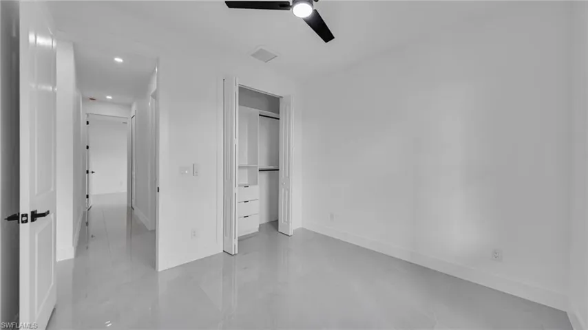 Unfurnished bedroom featuring recessed lighting, a closet, and a ceiling fan